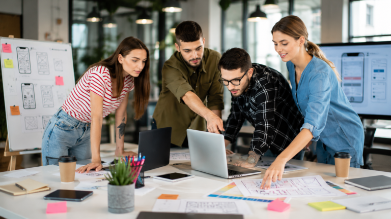 Restaurant app development team working together on a custom digital platform